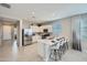 Modern kitchen equipped with stainless steel appliances, a center island, and sleek white cabinetry at 24969 N 173Rd Ln, Surprise, AZ 85387
