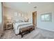 Bright main bedroom featuring a neutral color palette, plush carpet, and stylish decor at 24969 N 173Rd Ln, Surprise, AZ 85387