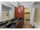 Bathroom with double vanity, granite countertop, and large bathtub at 3302 N 7Th St # 226, Phoenix, AZ 85014