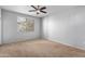 Bright bedroom with carpeted floor and large window with blinds at 3302 N 7Th St # 226, Phoenix, AZ 85014