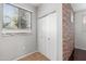 Spacious closet with double doors and brick accent wall at 3302 N 7Th St # 226, Phoenix, AZ 85014