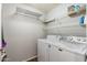 Laundry room with washer, dryer, and shelving at 3302 N 7Th St # 226, Phoenix, AZ 85014