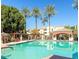 Inviting community pool with palm trees and seating at 3302 N 7Th St # 226, Phoenix, AZ 85014