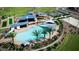 Aerial view of resort-style pool with expansive deck, shaded areas, and nearby amenities at 43513 N Wollemi St, Queen Creek, AZ 85140
