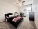 This bedroom features neutral carpet, ceiling fan, natural light, and furniture at 4660 E Torrey Pines Ln, Chandler, AZ 85249
