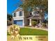 Charming two-story home with well-manicured lawn, blue trim and shutters, plus mature landscaping at 4660 E Torrey Pines Ln, Chandler, AZ 85249