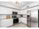 Modern kitchen featuring stainless steel appliances, ample cabinet space, and easy to clean tile flooring at 4660 E Torrey Pines Ln, Chandler, AZ 85249