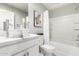 Bright bathroom featuring a modern vessel sink, vanity with marble countertop, shower and bathtub at 735 E Calavar Rd, Phoenix, AZ 85022
