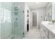 Stylish bathroom showcasing a seamless glass shower, modern fixtures, and a neutral color palette at 735 E Calavar Rd, Phoenix, AZ 85022