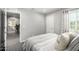 Comfortable bedroom offering stylish decor and access to another room in the house at 735 E Calavar Rd, Phoenix, AZ 85022
