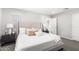 Serene bedroom with a plush bed, soft neutral tones, and coordinated decor for a relaxing retreat at 735 E Calavar Rd, Phoenix, AZ 85022