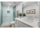 Modern bathroom with a walk-in shower and white vanity at 2031 E La Vieve Ln, Tempe, AZ 85284