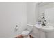 Modern powder room with pedestal sink and toilet at 23321 N 41St St, Phoenix, AZ 85050