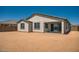 View of the backyard with a covered patio and stucco exterior at 25353 N 176Th Ave, Surprise, AZ 85387