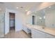 Bright bathroom with dual sinks, modern fixtures, and a walk-in shower at 25353 N 176Th Ave, Surprise, AZ 85387