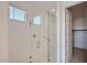Modern glass-enclosed shower featuring sleek hardware and white tiled walls at 25353 N 176Th Ave, Surprise, AZ 85387