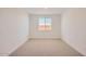 Cozy bedroom featuring neutral carpet and a window with blinds at 25353 N 176Th Ave, Surprise, AZ 85387