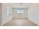 Well-lit bedroom featuring tile floors, recessed lighting, and a large window with blinds at 25353 N 176Th Ave, Surprise, AZ 85387