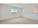 Neutral bedroom with carpeted floors, recessed lighting, and natural light from large windows at 25353 N 176Th Ave, Surprise, AZ 85387