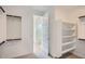 Walk-in closet with open shelving for storage and organization at 25353 N 176Th Ave, Surprise, AZ 85387