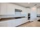 Well-designed kitchen with white cabinets, stainless steel appliances, a gas stovetop, and granite countertops at 25353 N 176Th Ave, Surprise, AZ 85387