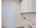 Clean laundry room with upper cabinets and available washer/dryer hookups at 25353 N 176Th Ave, Surprise, AZ 85387