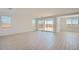Bright living room featuring tile floors, recessed lighting, and sliding glass doors leading to the backyard at 25353 N 176Th Ave, Surprise, AZ 85387