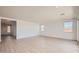 Spacious living room featuring tile floors, recessed lighting, and several windows offering natural light at 25353 N 176Th Ave, Surprise, AZ 85387