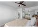 Serene bedroom with queen bed, ceiling fan, and mirrored closet at 3500 N Hayden Rd # 1902, Scottsdale, AZ 85251