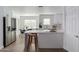 Modern kitchen with white cabinets, quartz counters, and stainless steel appliances at 3500 N Hayden Rd # 1902, Scottsdale, AZ 85251