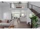 Open concept living area with loft, modern kitchen, and stylish furnishings at 3500 N Hayden Rd # 1902, Scottsdale, AZ 85251