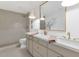 Modern bathroom with double sinks, a large mirror, and stylish tile at 3800 E Lincoln Dr # 1, Phoenix, AZ 85018