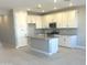 Modern kitchen featuring white cabinets and an island at 43386 N Wollemi St, Queen Creek, AZ 85140