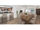 Light and airy dining area with wood table and chairs at 4340 E Nisbet Rd, Phoenix, AZ 85032