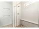 Large shower with glass enclosure, stone flooring and built-in seat at 4340 E Nisbet Rd, Phoenix, AZ 85032