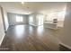 Bright, open floor plan with tile floors connects the living area and modern kitchen, perfect for entertaining at 43429 N Wollemi St, Queen Creek, AZ 85140