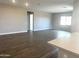 Spacious open-concept room with tile flooring, neutral walls, recessed lighting, and large windows at 43429 N Wollemi St, Queen Creek, AZ 85140