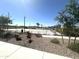 Community park with a basketball court, pool, walking paths, and green spaces at 43499 N Wollemi St, Queen Creek, AZ 85140