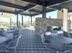 Community pavilion with stone fireplace, BBQ grills and dining areas for entertaining at 43499 N Wollemi St, Queen Creek, AZ 85140
