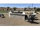 Relaxing fire pit area with comfortable seating is ideal for cool evenings at 43499 N Wollemi St, Queen Creek, AZ 85140
