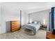 Cozy bedroom with a comfortable bed and wooden dresser at 805 N 4Th Ave # 609, Phoenix, AZ 85003