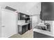 Modern kitchen with dark cabinets and white countertops at 805 N 4Th Ave # 609, Phoenix, AZ 85003