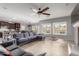 Bright, open-concept living space with tile floors and a kitchen visible in the background at 9982 W Villa Chula --, Peoria, AZ 85383