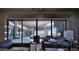 Living room with sliding glass doors opening to a courtyard at 10420 N 64Th Pl, Paradise Valley, AZ 85253