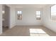 Vacant bedroom with neutral carpet, recessed lighting and a bright window at 12337 W Marguerite Ave, Avondale, AZ 85323