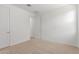 Carpeted bedroom showcasing white walls and a double door closet at 12337 W Marguerite Ave, Avondale, AZ 85323