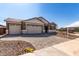 Well maintained home with a three car garage, desert landscaping and brick paved driveway at 12337 W Marguerite Ave, Avondale, AZ 85323