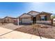 Well maintained home with a two car garage, desert landscaping and brick paved driveway at 12337 W Marguerite Ave, Avondale, AZ 85323