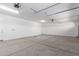 Spacious garage with overhead lighting, lots of room for vehicles and storage at 12337 W Marguerite Ave, Avondale, AZ 85323