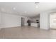 Open-concept living space with tile floors, recessed lighting, and a kitchen view at 12337 W Marguerite Ave, Avondale, AZ 85323